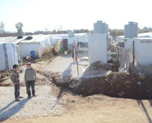Syrian refugee camps, like this one in the Bekaa Valley in Lebanon, have provided safety from violence but were unable to provide resident with warm clothing, heaters and other items needed to survive winter. (Photo by Leah Reynolds) 