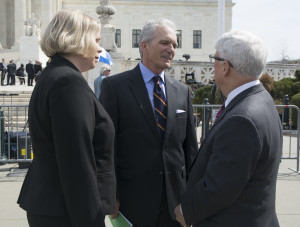 Brent Walker and Jennifer Hawks of the Baptist Joint Committee talk after the hearing with former solicitor general Walter Dellinger. (BJC Photo/Cherilyn Crowe)
