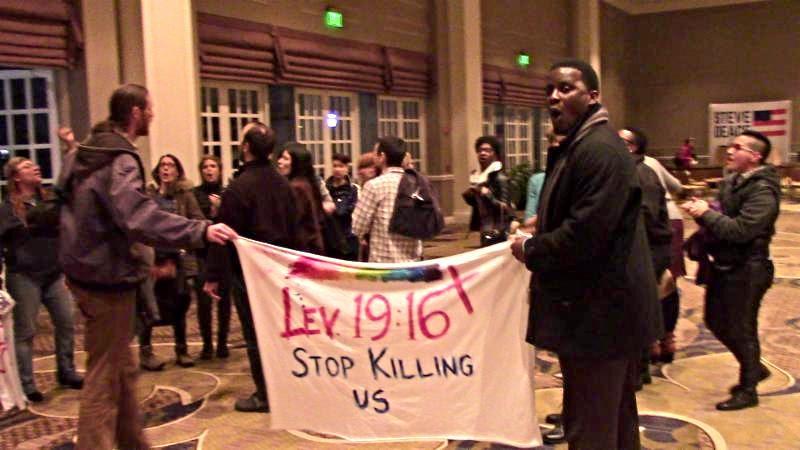 Protestors at the NRB meeting at the Gaylord Opryland Resort and Hotel in Nashville.