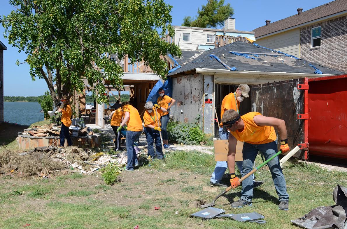 Members of The Woods Baptist Church in Tyler, Texas, help repair the home and yard of a retired Rowlette couple whose property was damaged by a tornado in December 2015. (Photo/Texas Baptists)