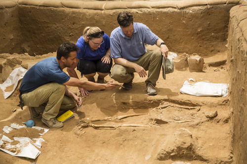 Adam Aja of the Harvard Semitic Museum, Sherry Fox and Daniel Master of Wheaton College consult in the Philistine cemetery at Ashkelon. (Photo/Leon Levy Expedition to Ashkelon)