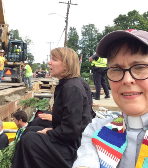 Betsy Sowers, right, and UCC minister Lindsay Popper in the pipeline trench in West Roxbury, Mass., prior to their arrest on Sept. 20. (Photo courtesy Betsy Sowers)