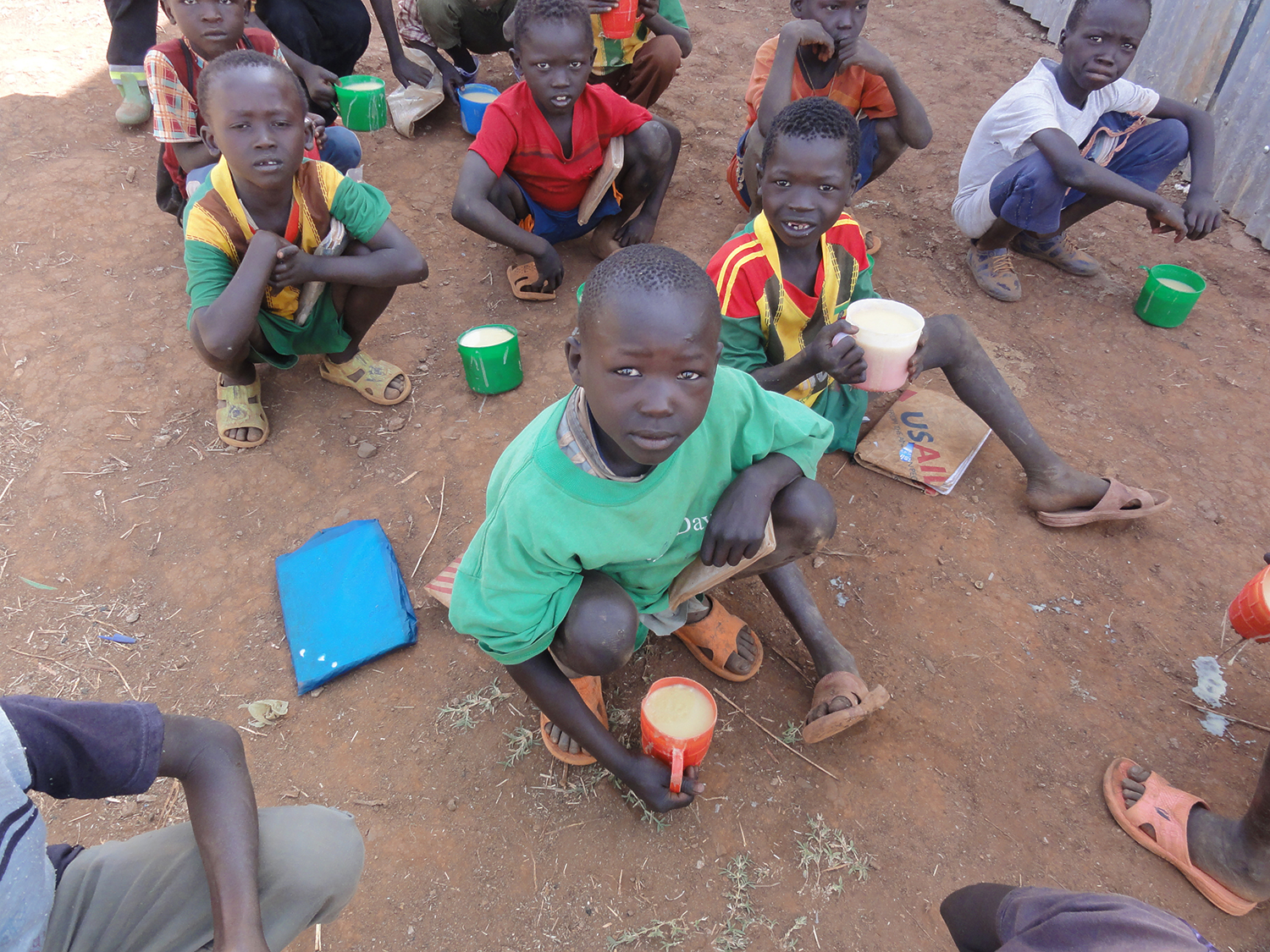 Sudanese refugee children enjoying mealtime. (Photo/Fitsum Aregawi/USAID)