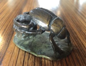 Brass sculpture of a dung beetle